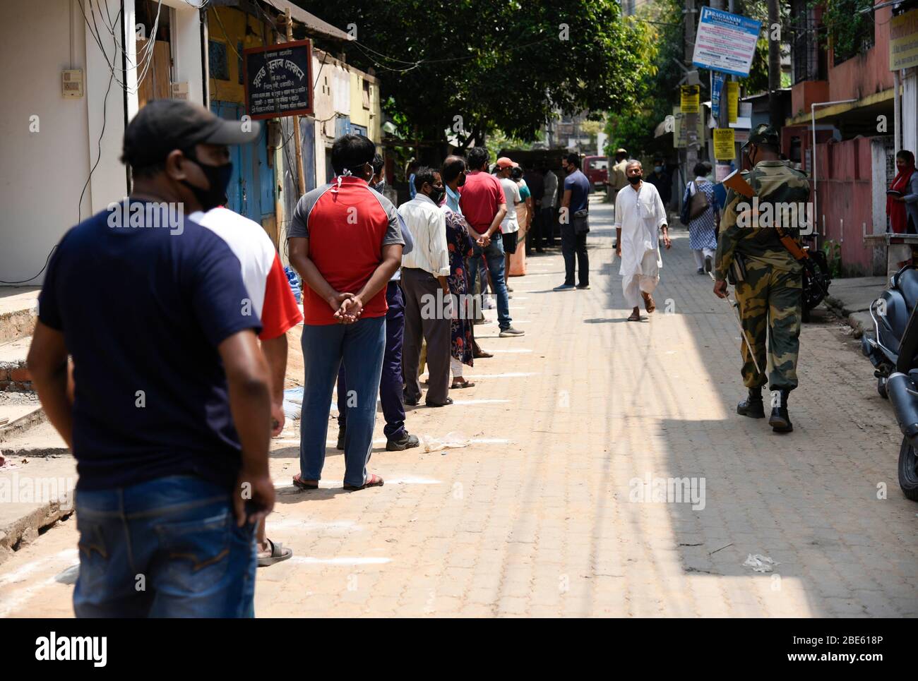 Guwahati, Assam, India. 10 April 2020. People are in que to buy chicken, during the nationwide lockdown to curb the spread of coronavirus, in Guwahati, Assam, India on Sunday, April 12, 2020. Credit: David Talukdar/Alamy Live News Stock Photo