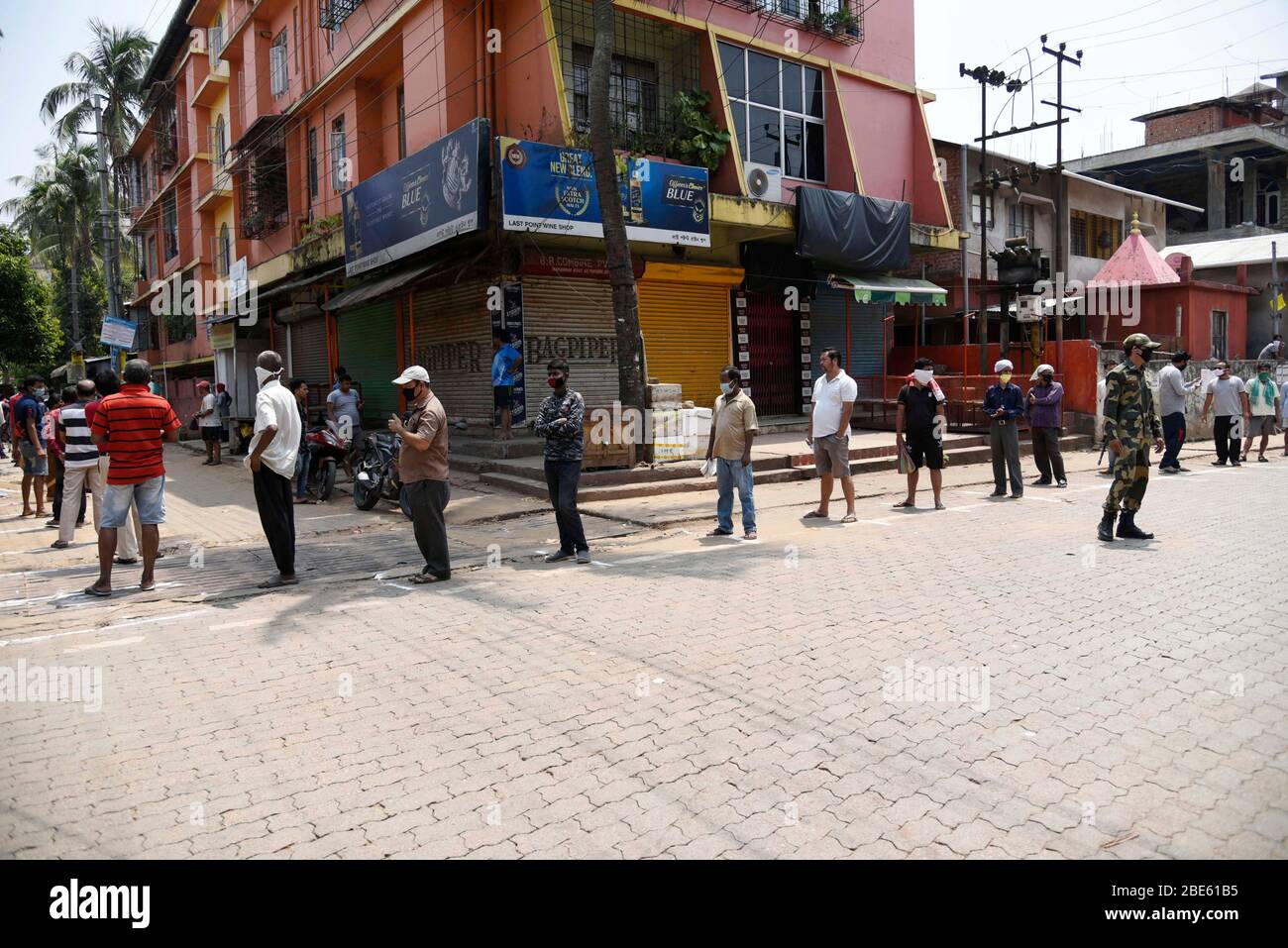 Guwahati, Assam, India. 10 April 2020. People are in que to buy chicken, during the nationwide lockdown to curb the spread of coronavirus, in Guwahati, Assam, India on Sunday, April 12, 2020. Credit: David Talukdar/Alamy Live News Stock Photo