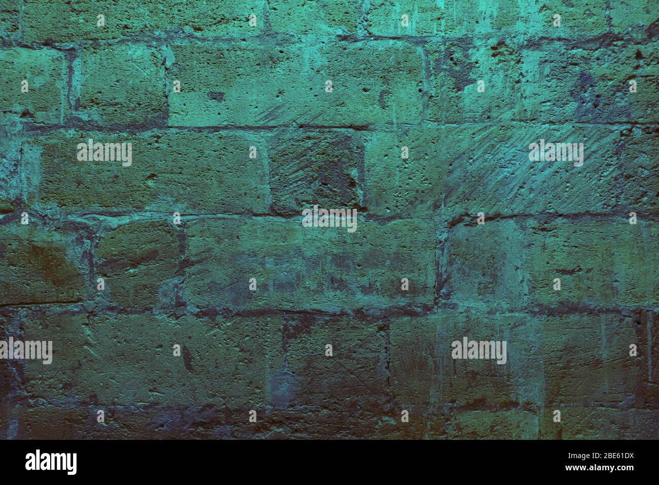 Old ancient bricks neon green and gray background,  Stock Photo