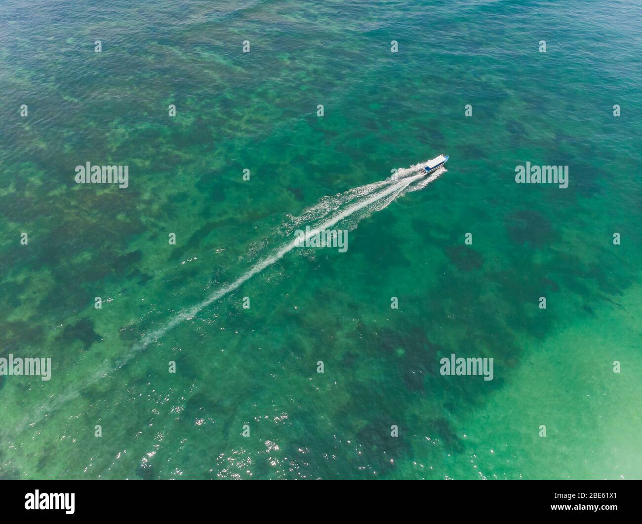 beautiful turquoise ocean water with boat on it top view aerial photo ...