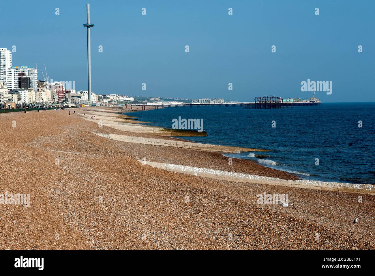 Brighton's popular beach is almost empty despite the sunny weather because of the British govt lockdown rules the wake of the coronavirus pandemic. Stock Photo