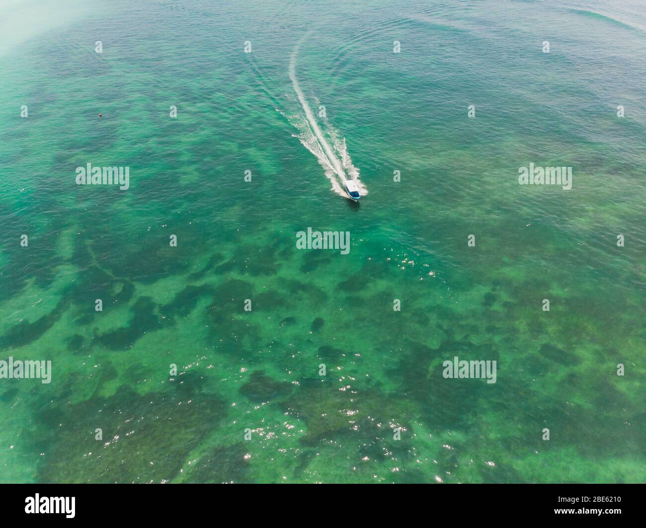 beautiful turquoise ocean water with boat on it top view aerial photo ...