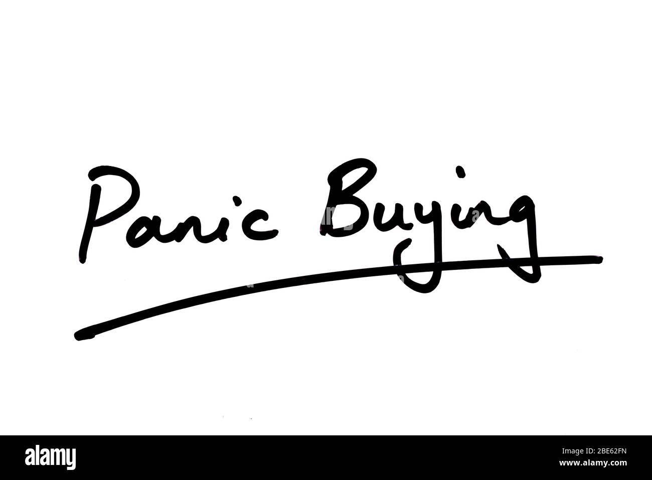Panic Buying handwritten on a white background. Stock Photo