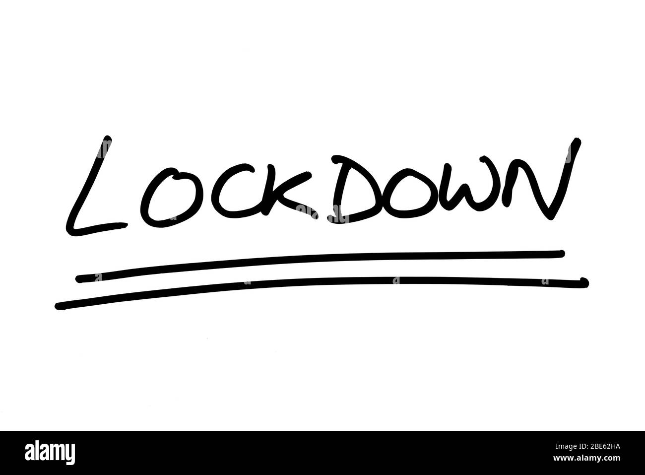 LOCKDOWN handwritten on a white background. Stock Photo