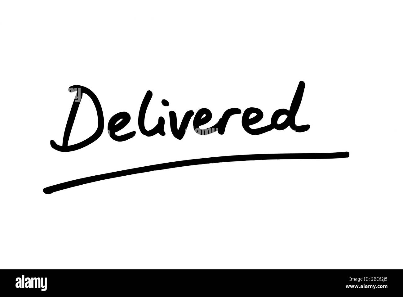 The word Delivered handwritten on a white background. Stock Photo