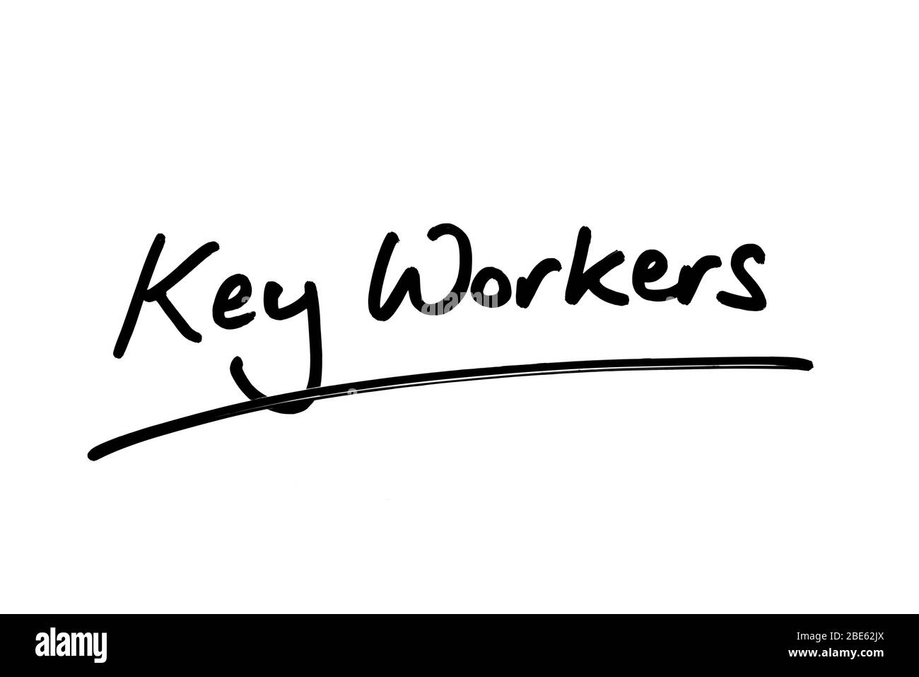 Key Workers handwritten on a white background. Stock Photo