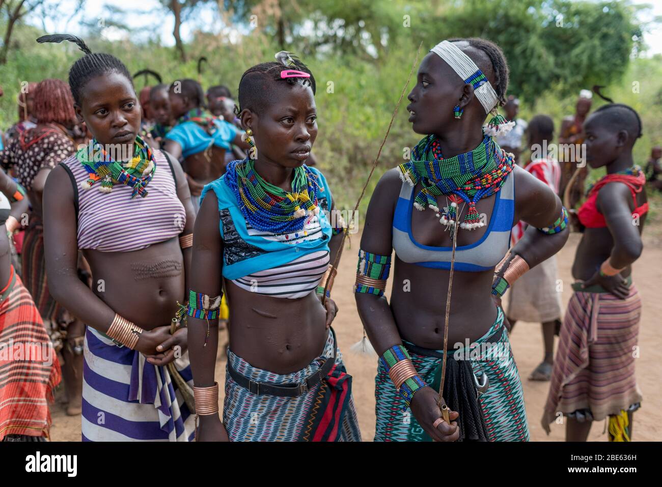 Young women at Mursi tribe ethnic group coming of age bull jumping ceremony, Jenka, Ethiopia, Stock Photo