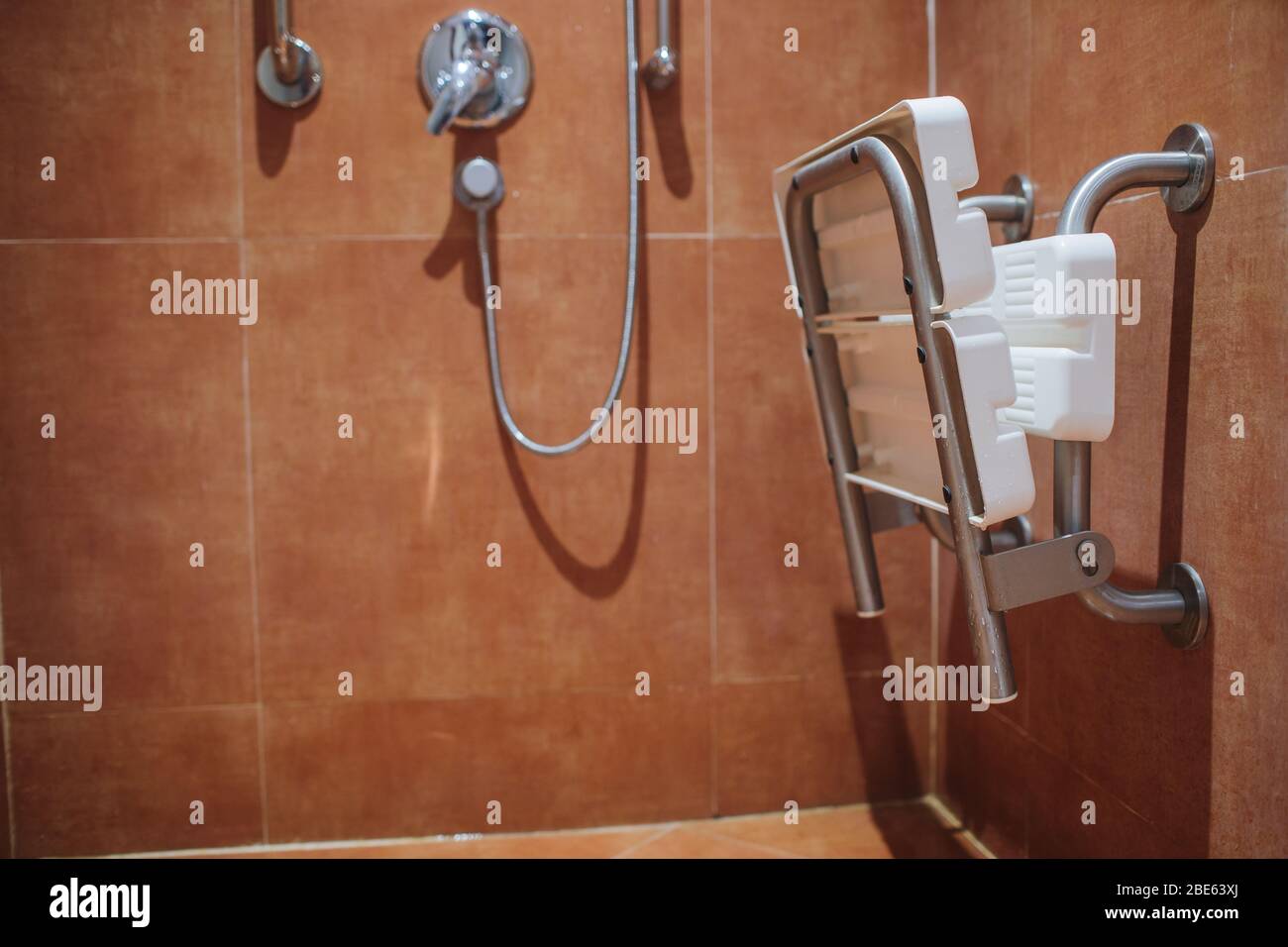 shower with seat and grab bars for disabled and elderly people in the