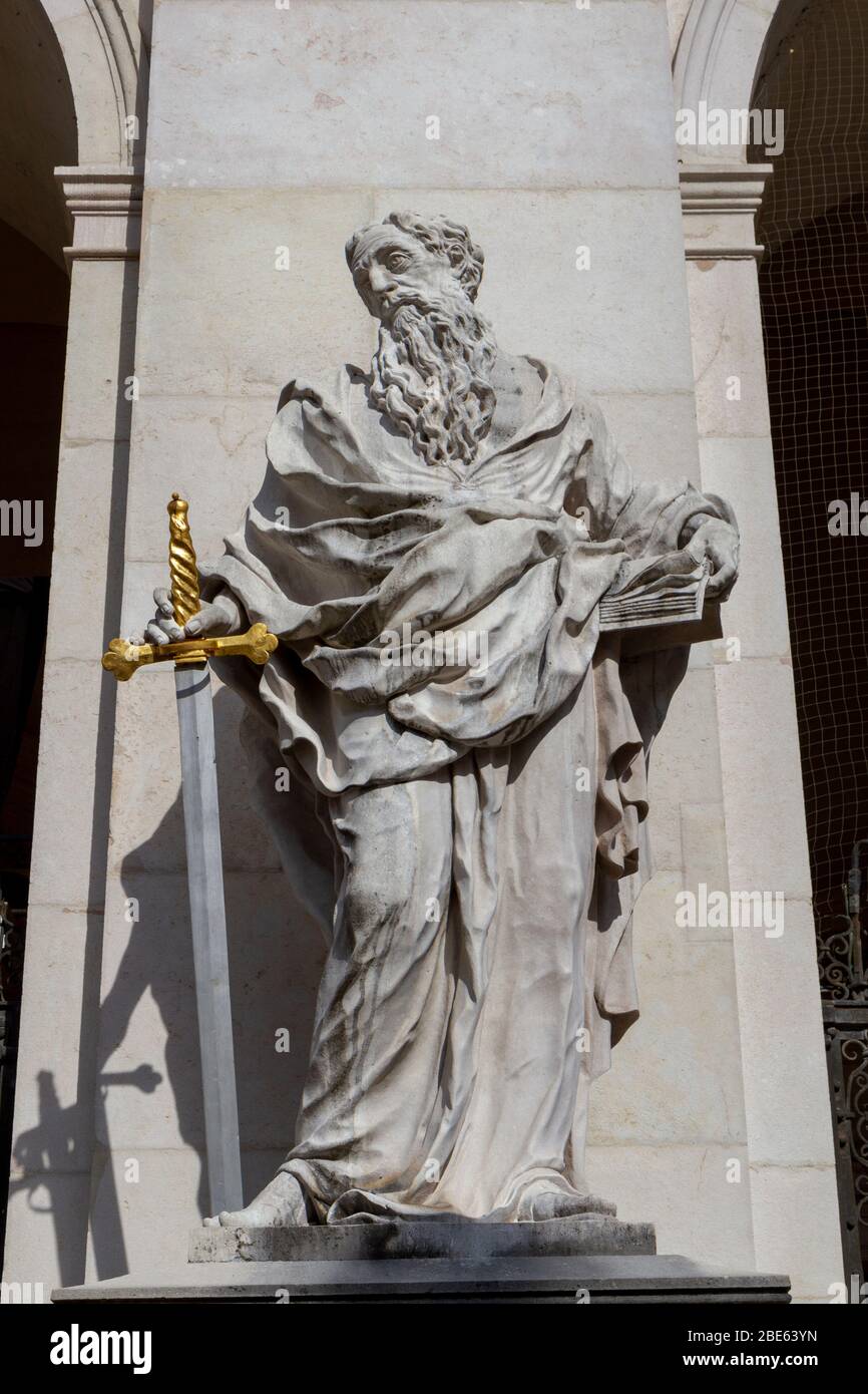 Statue of Saint Paul holding a sword, one of the four statues in front