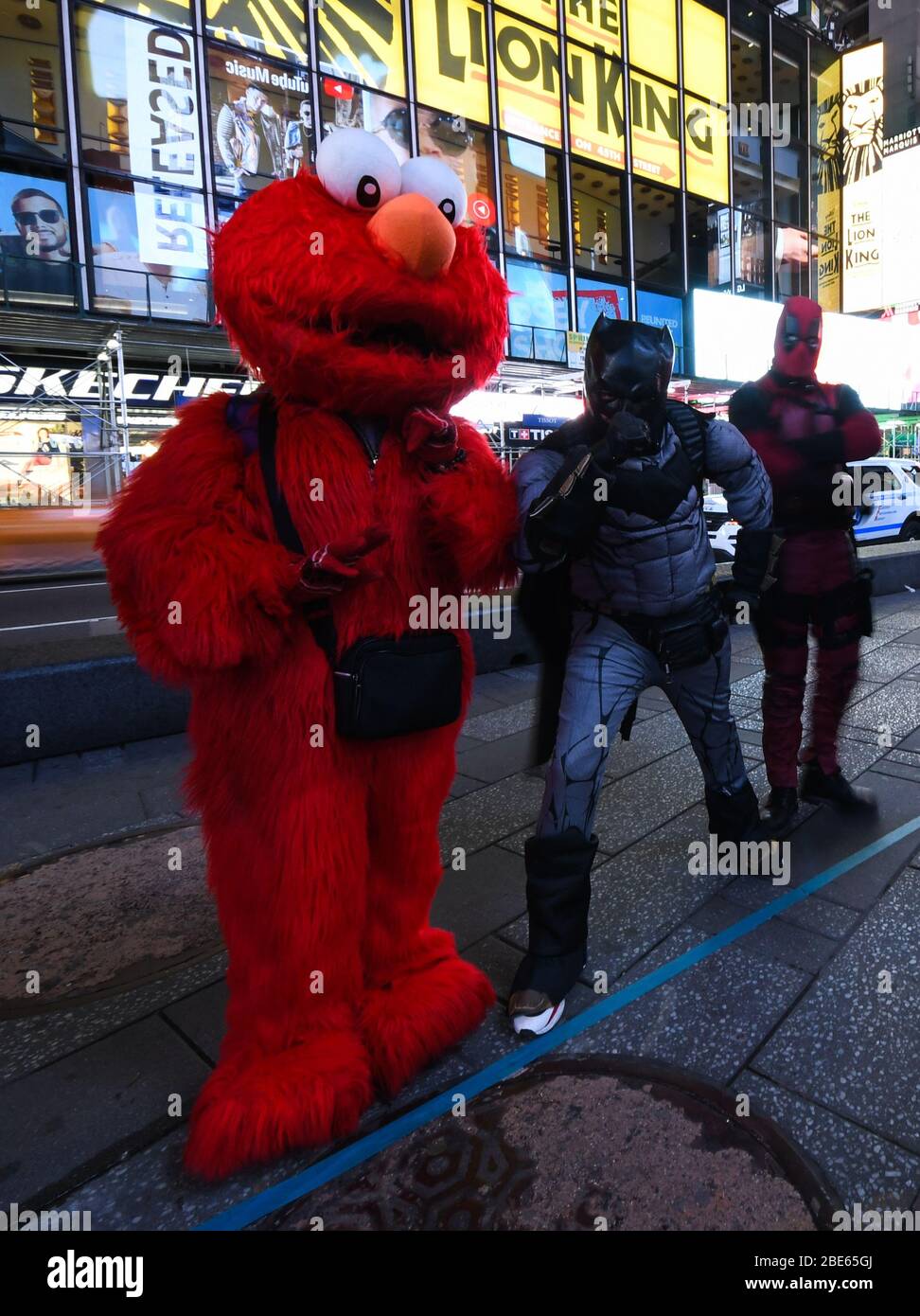 Costumed characters in Times Square NYC with no tourists during the