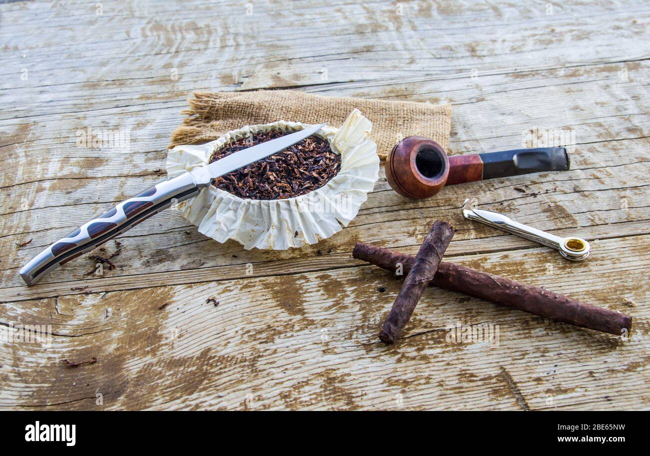 pleasure and enjoyment of slow smoking, its tools, pipe, tobacco, cigar