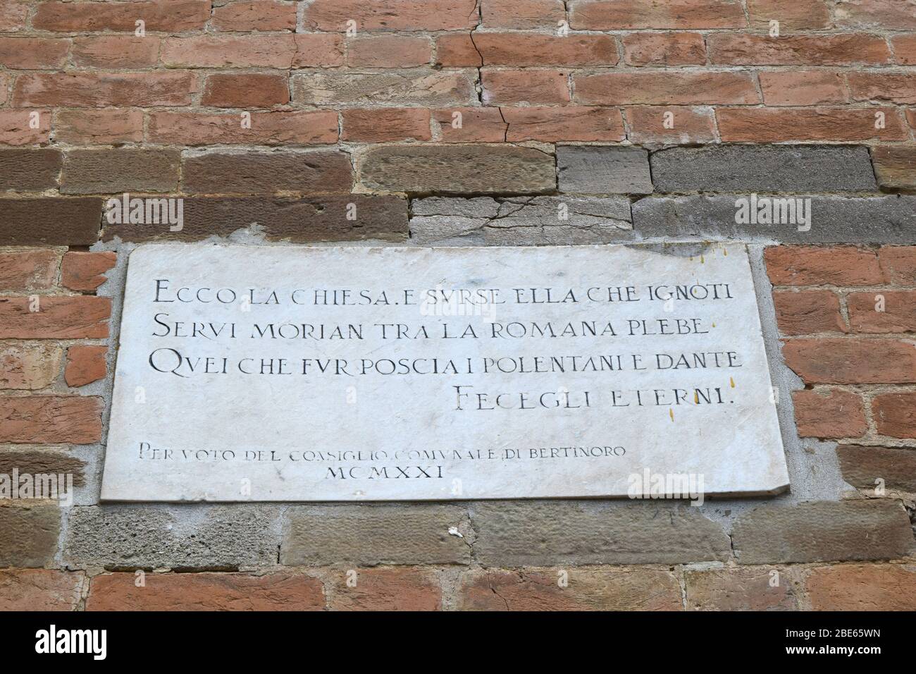 Pieve (rural parish Church) of San Donato in Polenta. Bertinoro, Italy. Facade detail – epigraph. Stock Photo
