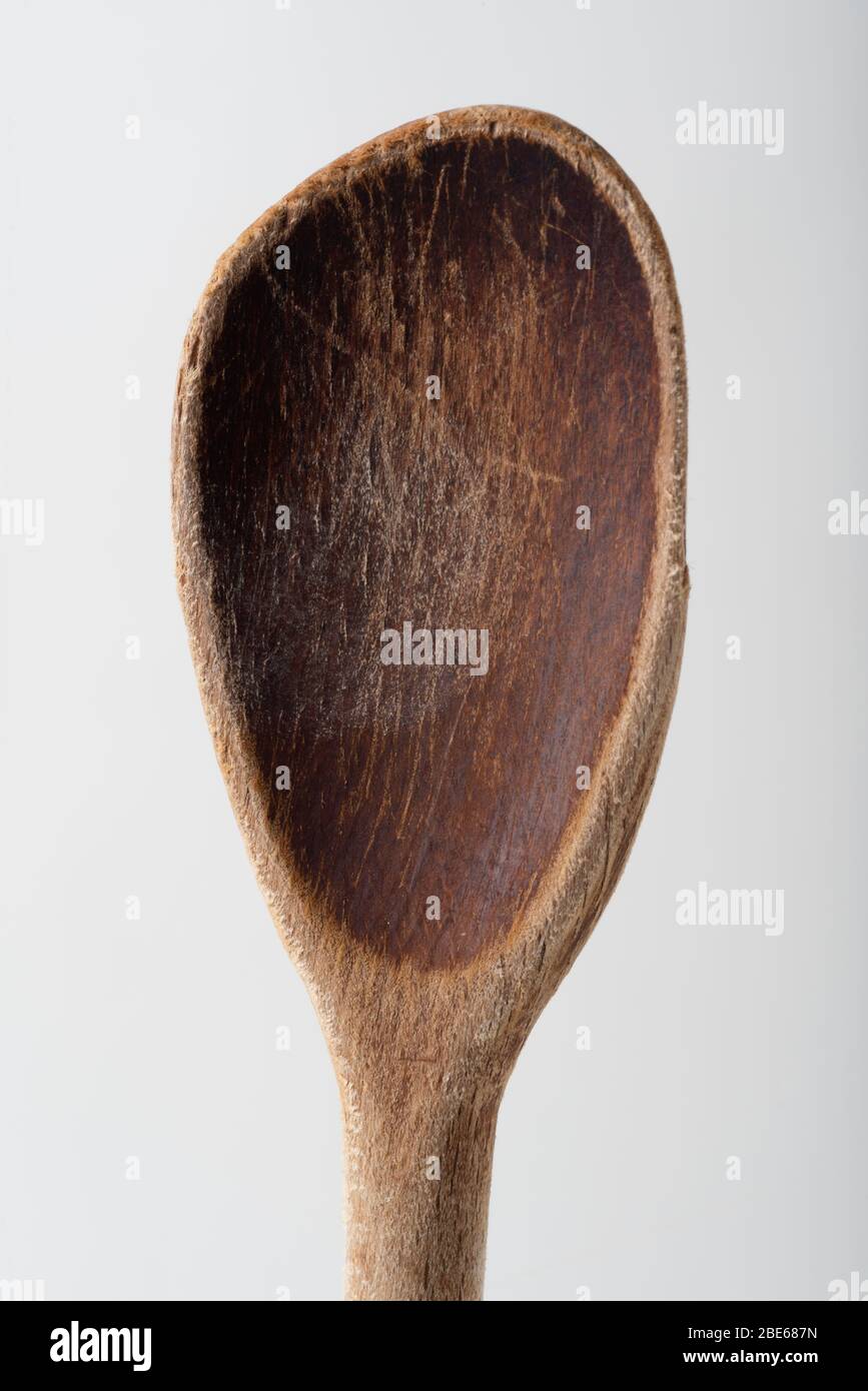 A long, wooden, stirring and mixing spoon made circa 1910, in the