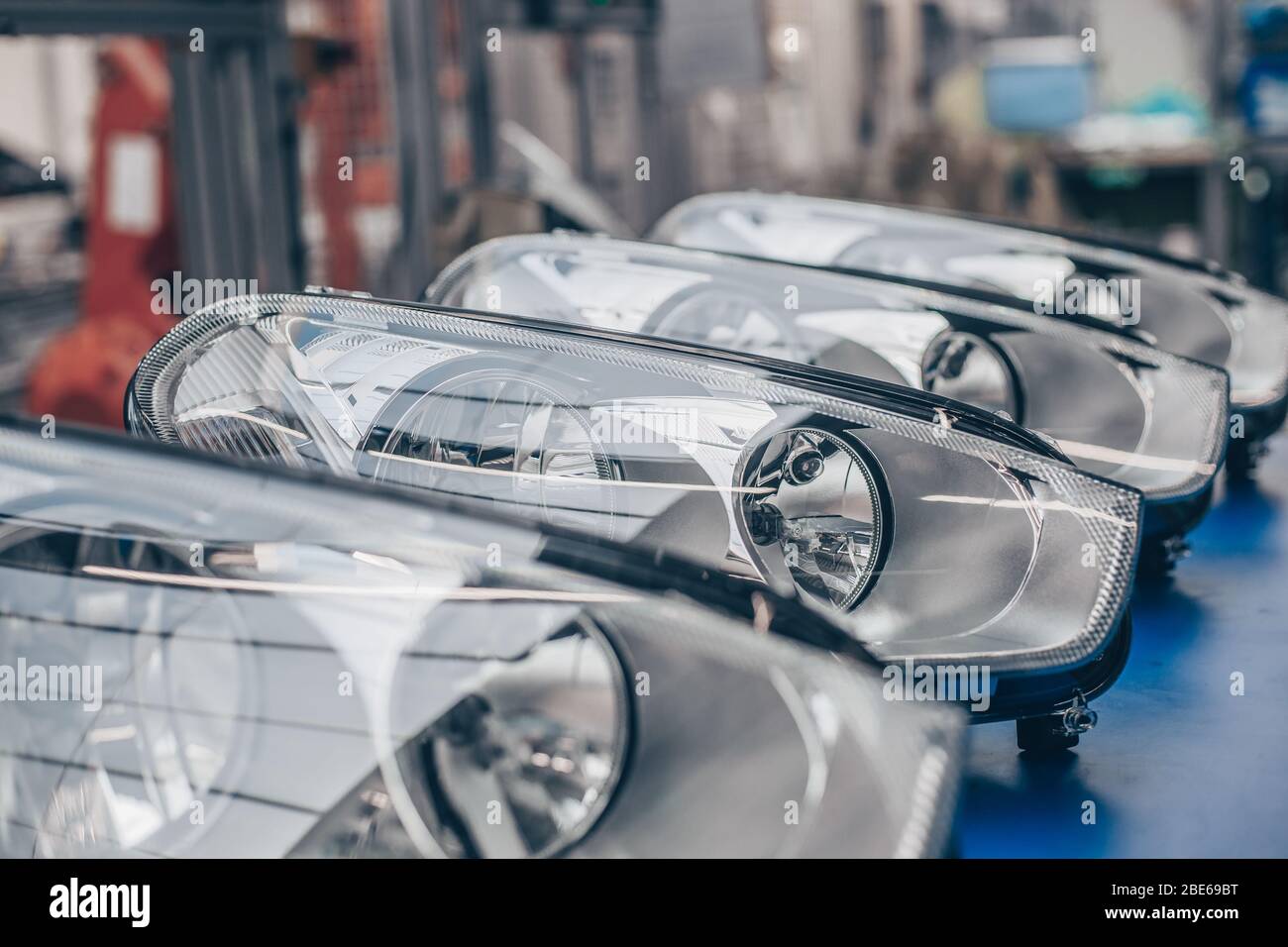 Close up of car headlamps, headlights in a row ready for assembly to the car, automotive industry concept Stock Photo