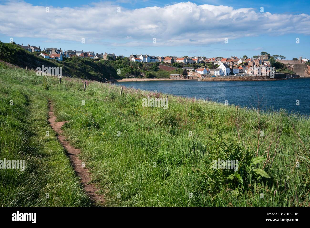 Narrow dirt trail leading to Crail fishing village, Fife Coastal Path
