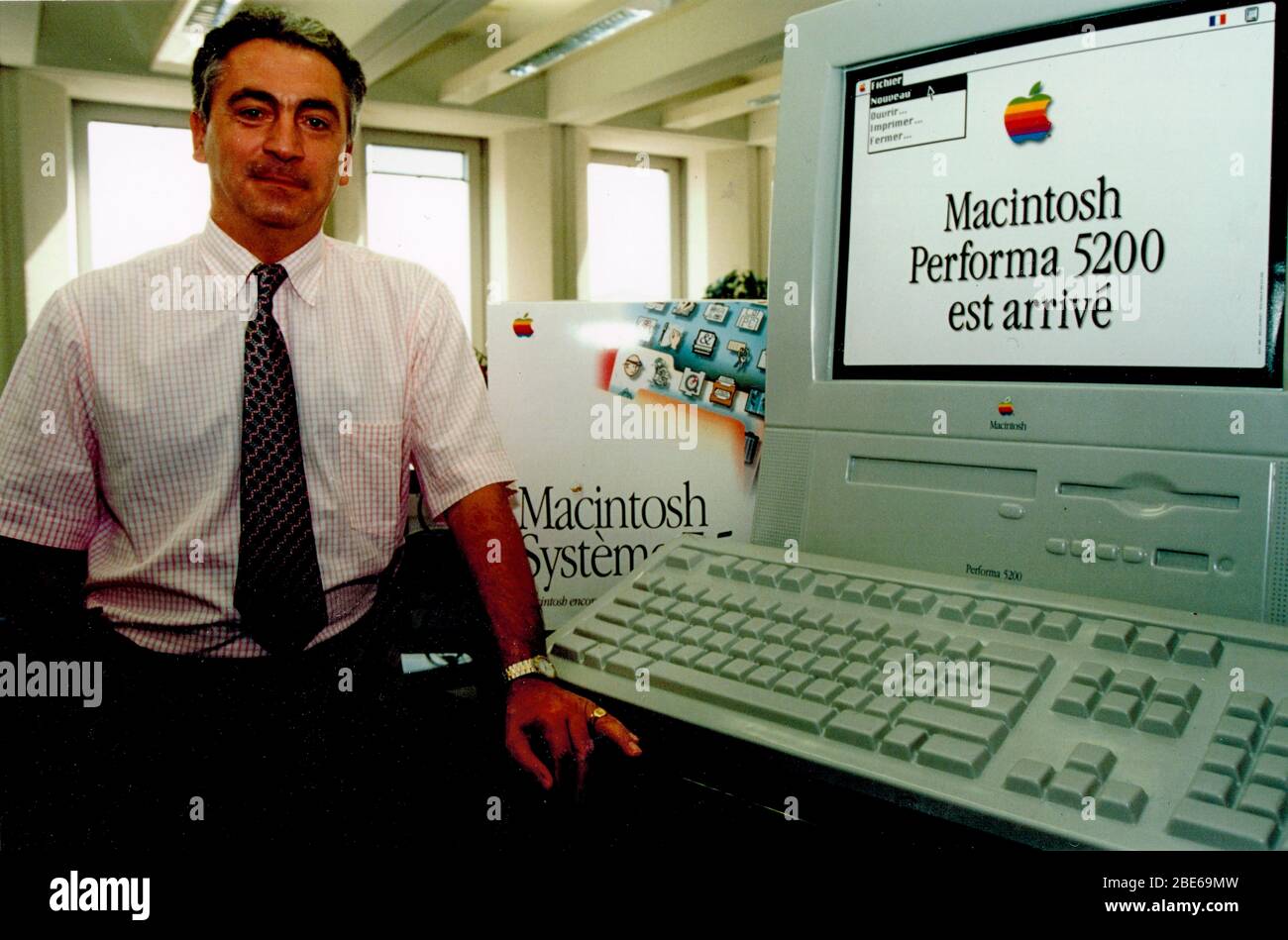 A computer seller presents new Apple Macintosh Performa 5200 computer, Lyon, 1995, France, Stock Photo