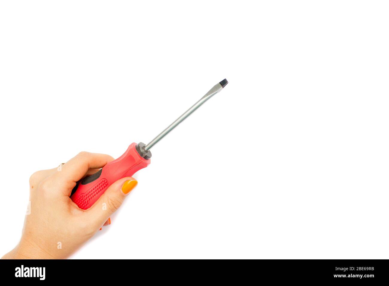 Black and red screwdriver isolated on white background. Screwdriver in hand. Screw screwdriver for repairing and tightening screws Stock Photo