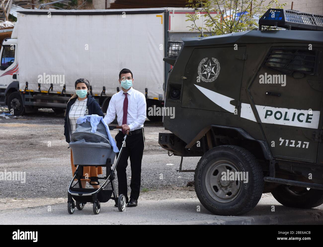 Jerusalem, Israel. 12th Apr, 2020. Orthodox Jews wear masks, as protection against the coronavirus, in the Givat Shaul neighborhood, in Jerusalem, on Sunday, April 12, 2020. The Israeli government deployed a 1,000 police to enforce a full closure on Jewish religious neighborhoods with the highest rate of coronavirus in Jerusalem. According to the Health Ministry about 75 percent of the infected in Jerusalem live in the Ultra-Orthodox neighborhoods. Photo by Debbie Hill/UPI Credit: UPI/Alamy Live News Stock Photo