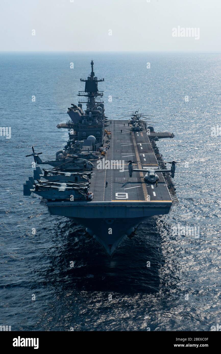 The U.S. Navy flagship America-class amphibious assault ship USS America during routine patrol April 10, 2020 in the East China Sea. Stock Photo