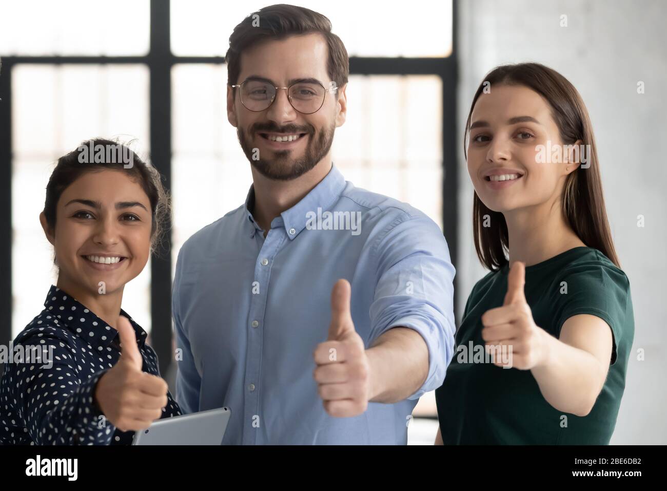 Portrait of diverse businesspeople show thumbs up Stock Photo