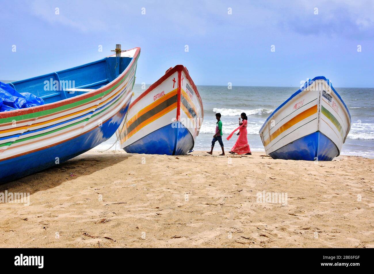 fishing boats and people at chavakkad beach kerala india Stock Photo