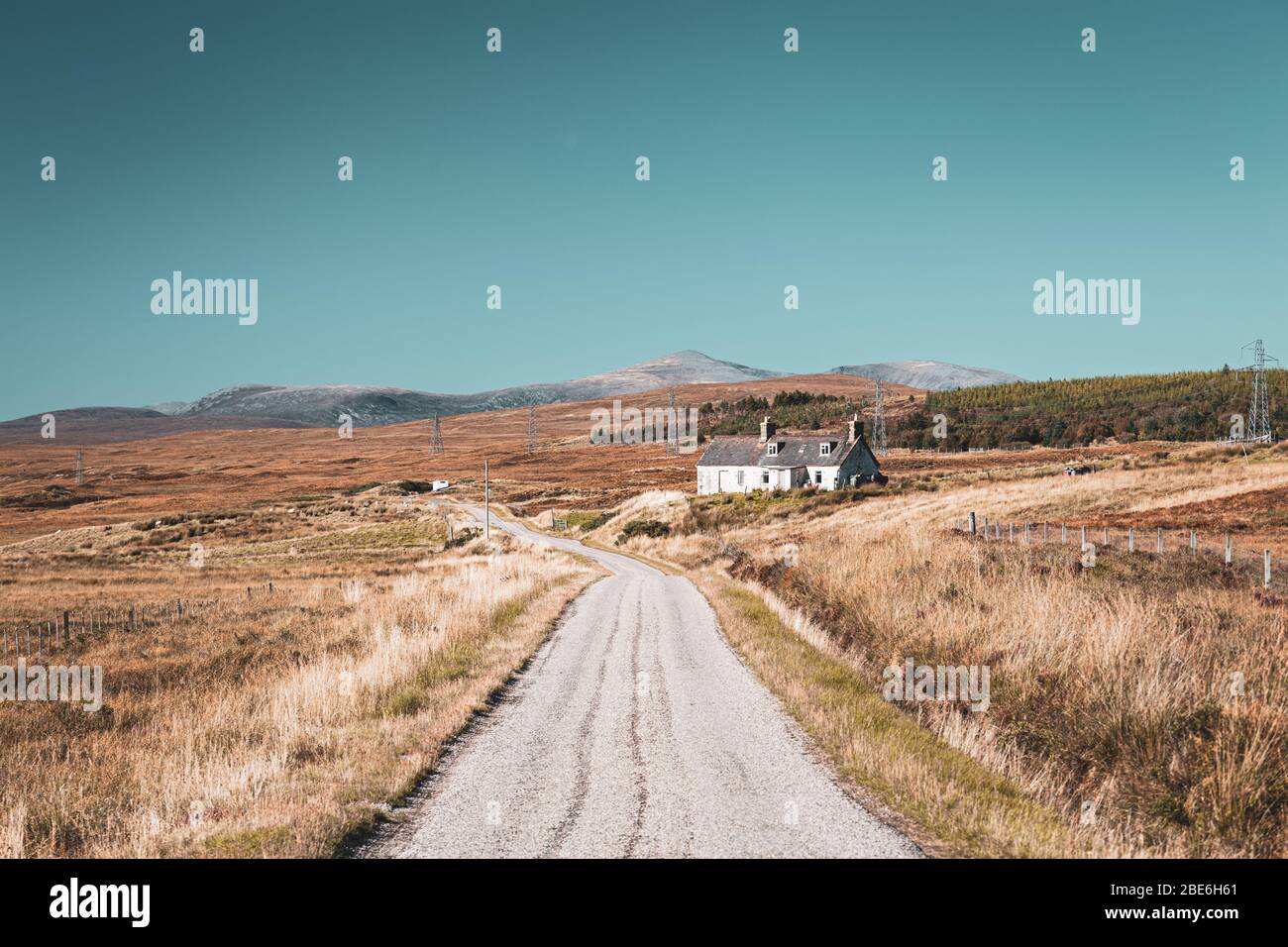 Empty countryside road across scenic landscape in the North West Highlands of Scotland Stock Photo