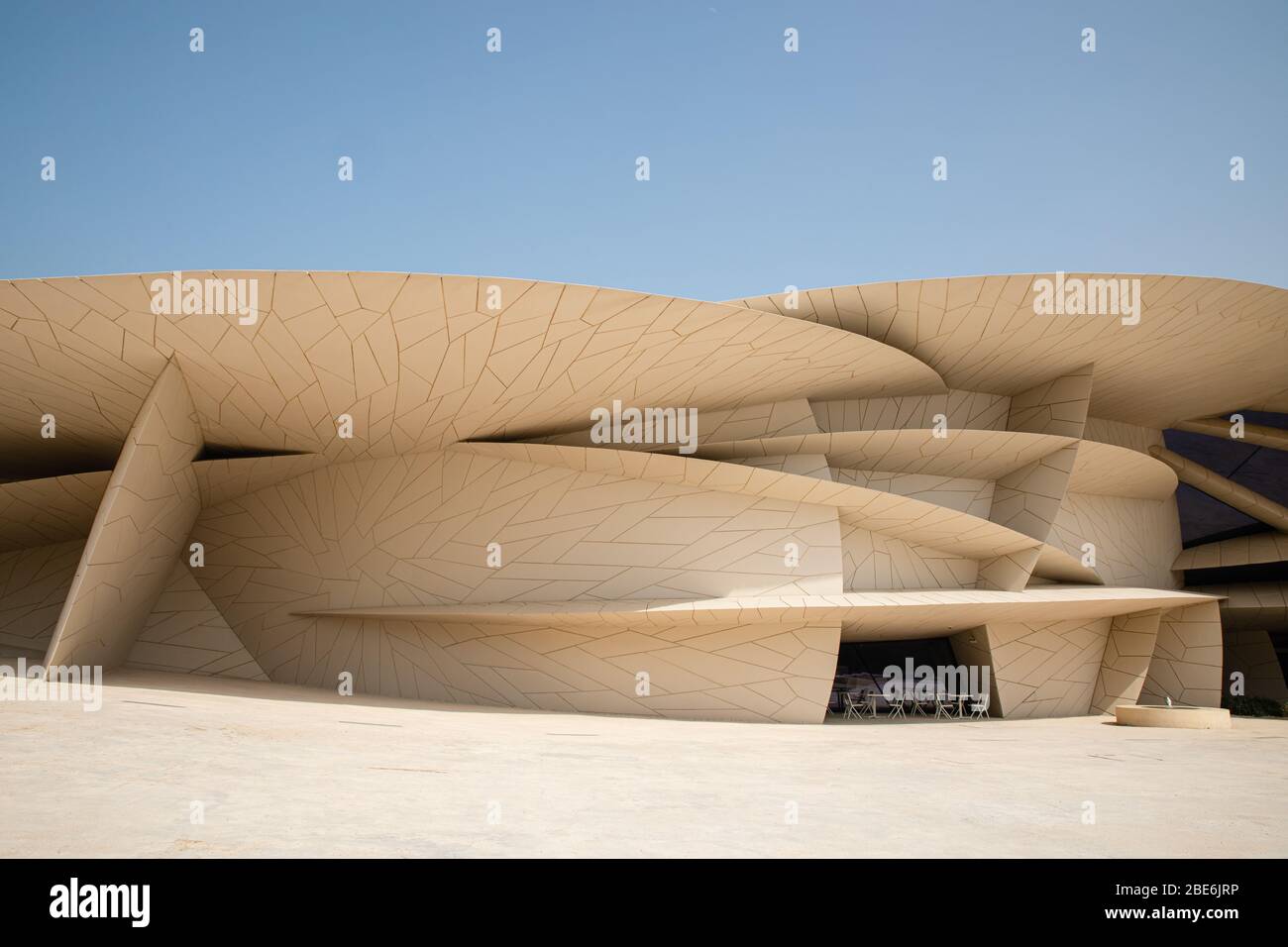 Modern contemporary architecture National Museum of Qatar by Jean Nouvel in Doha city with blue sky backgound Stock Photo