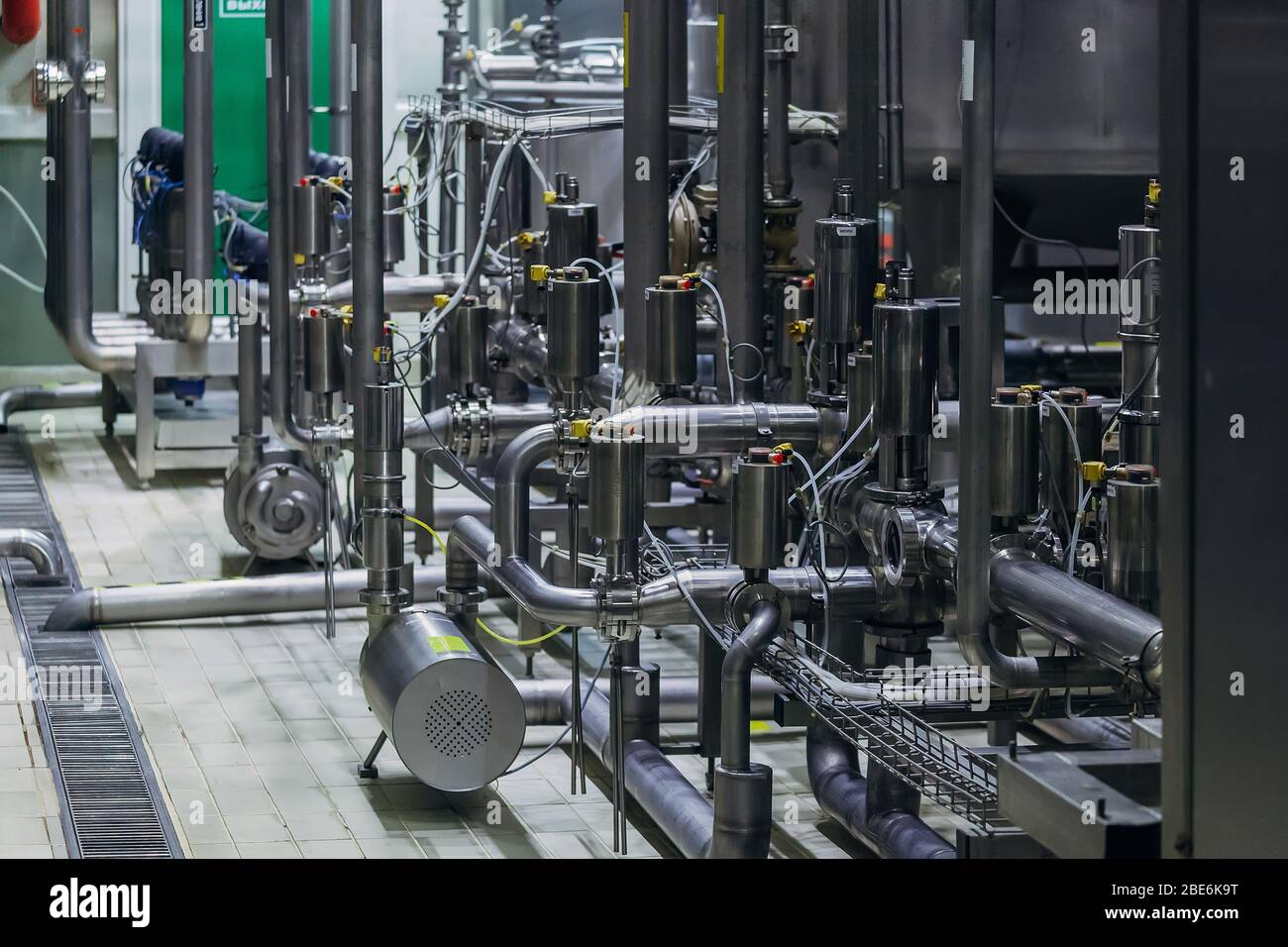 Industrial steel vats connected by pipeline Stock Photo Alamy