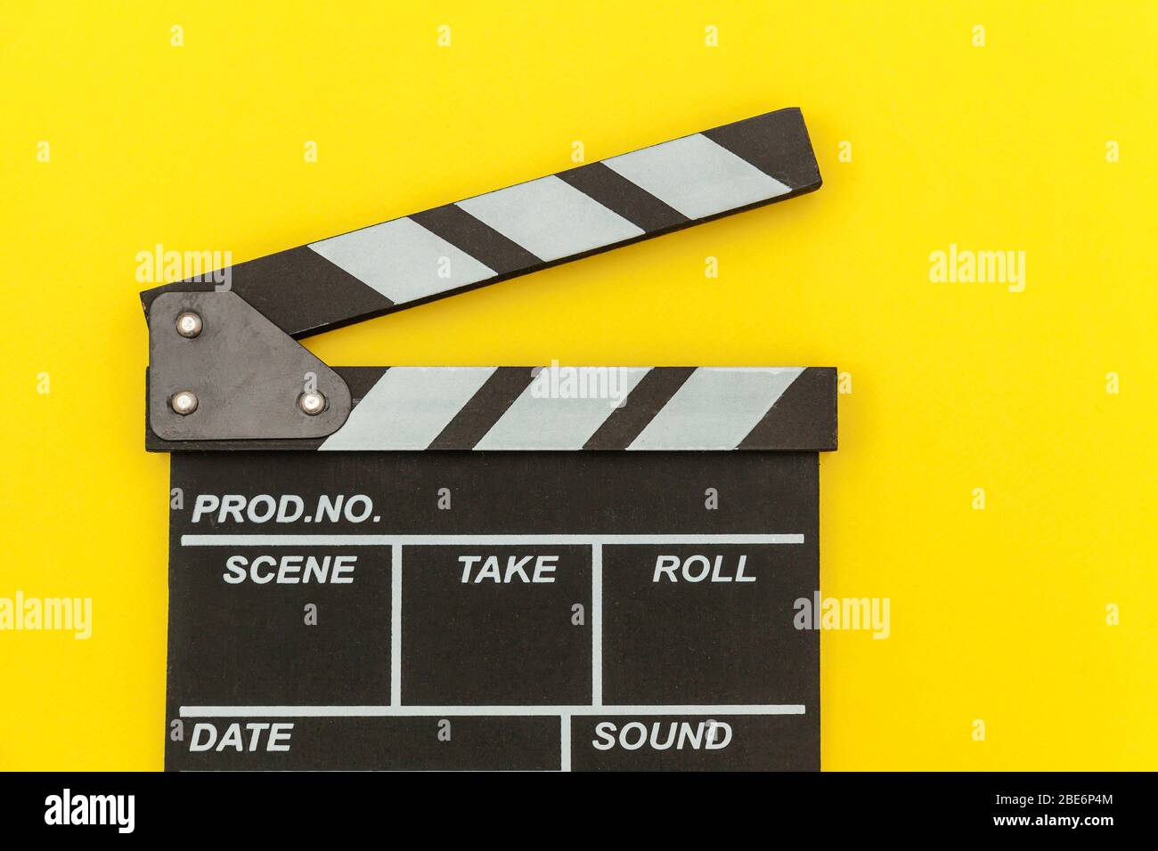 Filmmaker profession. Classic director empty film making clapperboard or  movie slate isolated on yellow background. Video production film cinema  industry concept. Flat lay top view copy space mock up Stock Photo -