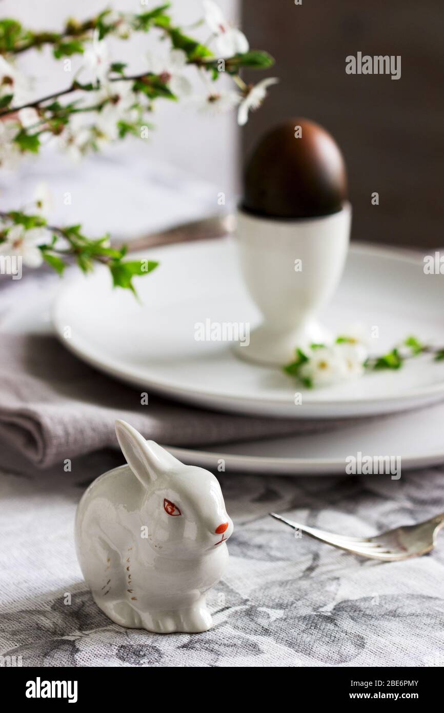 Decorated Easter table with blooming cherry plum. Stock Photo