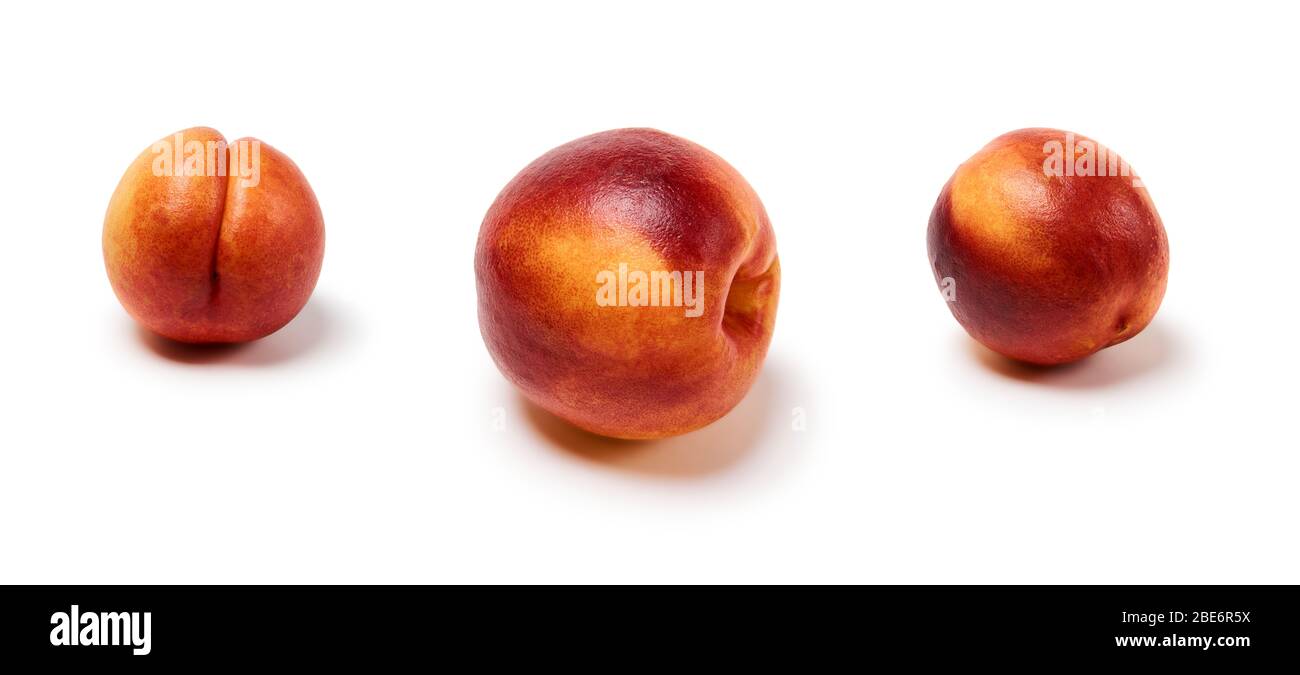 three ripe nectarines on a white background, isolated with a shadow Stock Photo