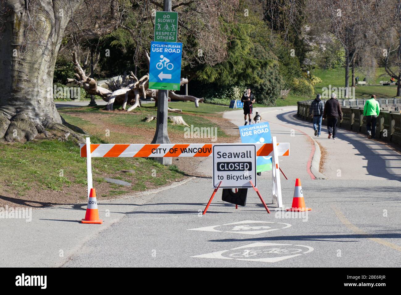 Vancouver, Canada - April 11, 2020: View of sign 'Seawall Closed to Bicycles' due to COVID-19(coronavirus) Stock Photo