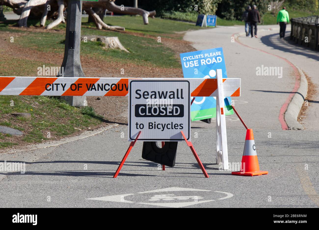 Vancouver, Canada - April 11, 2020: View of sign 'Seawall Closed to Bicycles' due to COVID-19(coronavirus) Stock Photo
