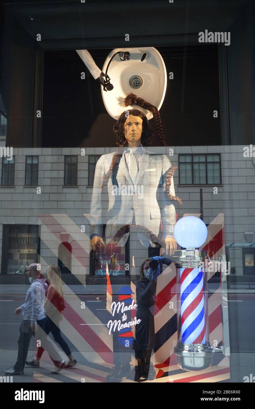 April 12, 2020, New York, New York, USA: Easter in New York City during Covid, .Store windows possibly spoofing  lack of hair cuts during self isolation,.Bergdorf Goodman MenÃ¢â‚¬â„¢s Store, .Fifth Avenue, NYC.April 12, 2020.Photos by Sonia Moskowitz. (Credit Image: ©  Sonia Moskowitz Gordon/ZUMA Wire) Stock Photo