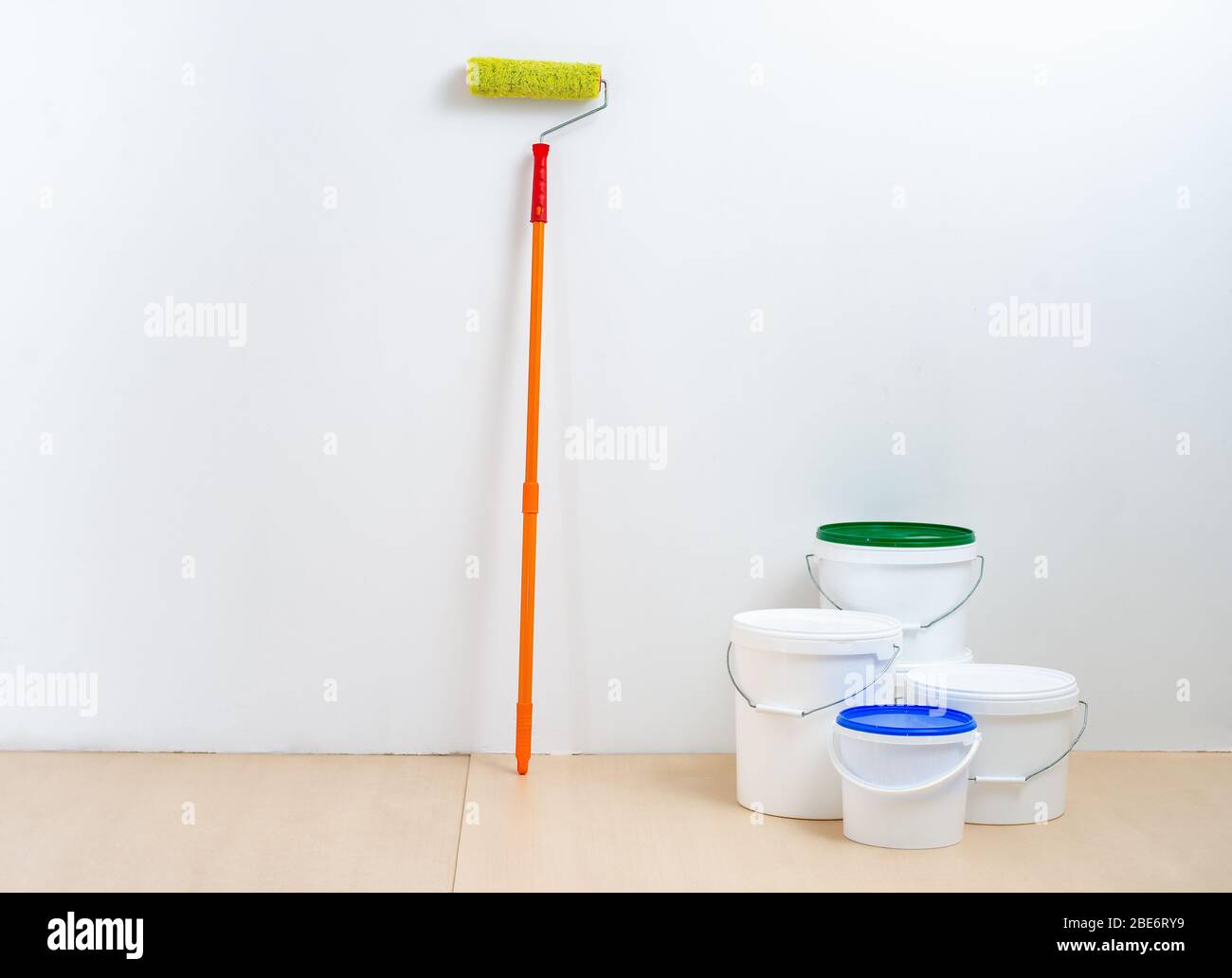 painting tool in the white room. Walls painting concept Stock Photo