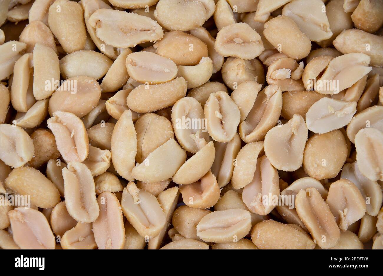 Salted and roasted peanuts background Stock Photo