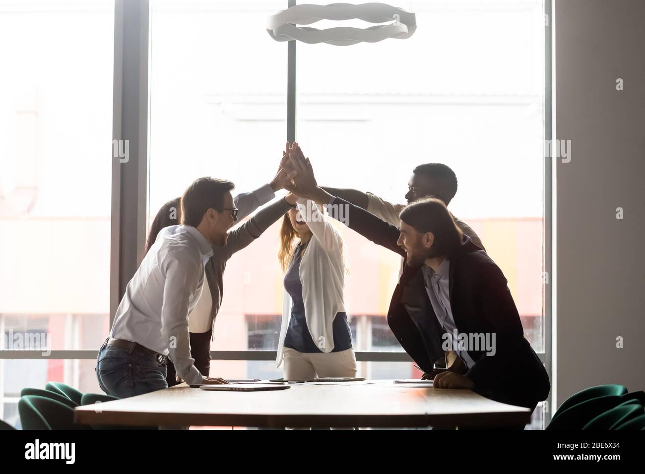 Excited diverse coworkers give hi-res stock photography and images - Alamy