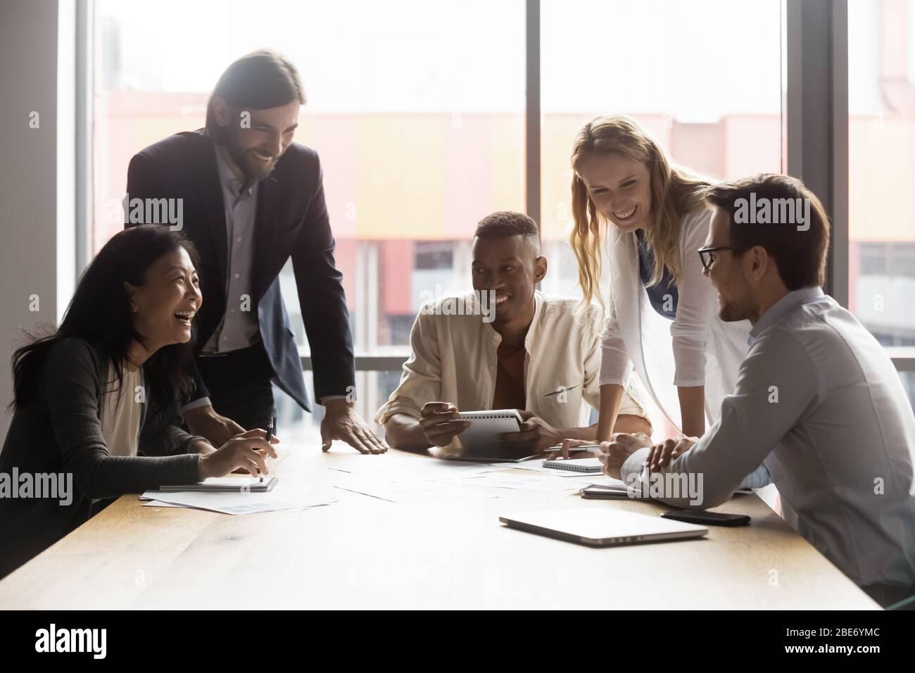Happy diverse colleagues have fun brainstorming at office meeting Stock ...