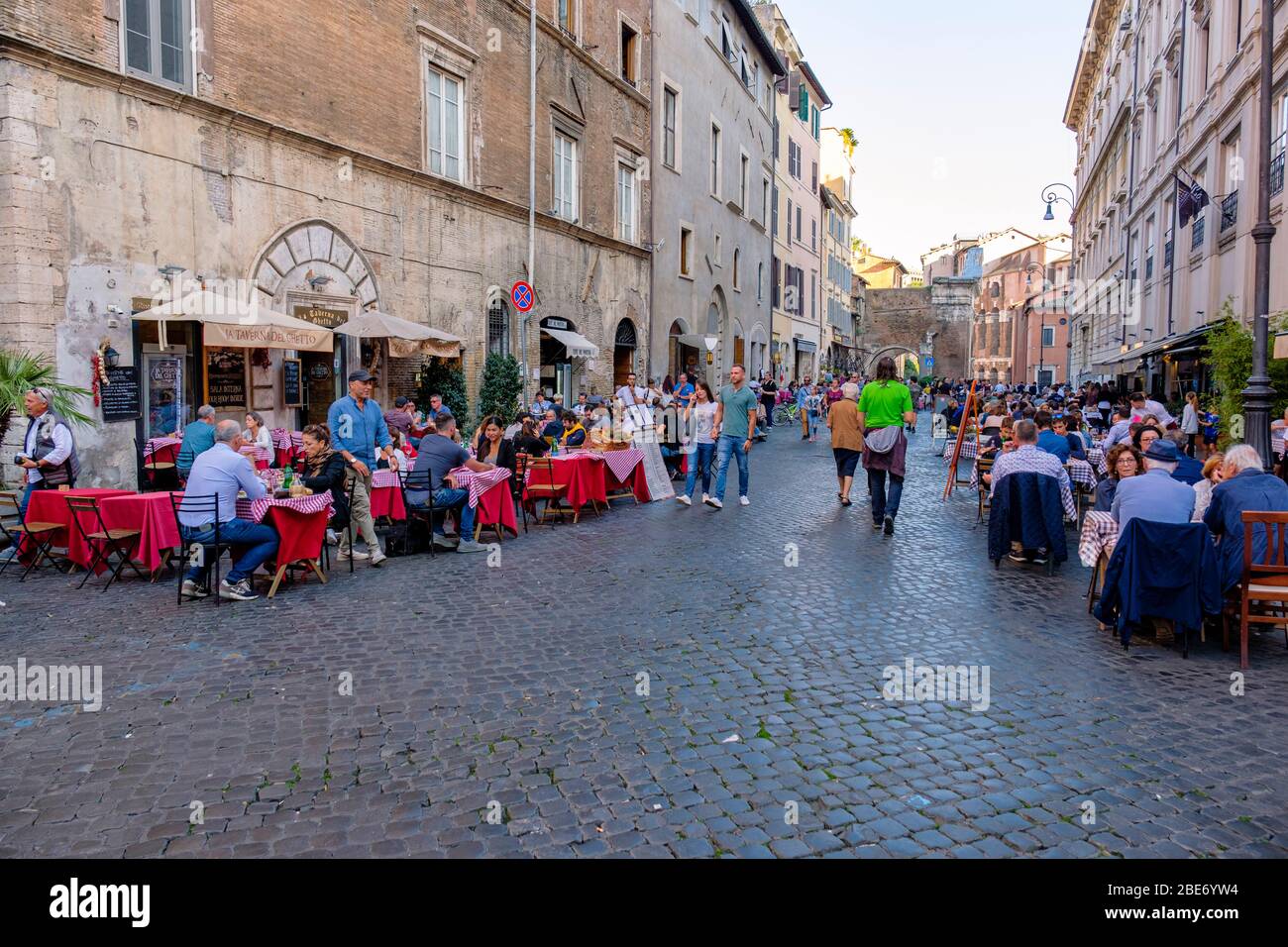 People eating outside at Via del Portico d'Ottavia, La Taverna del Ghetto Restaurant, Jewish Ghetto, Rome, Italy. Stock Photo