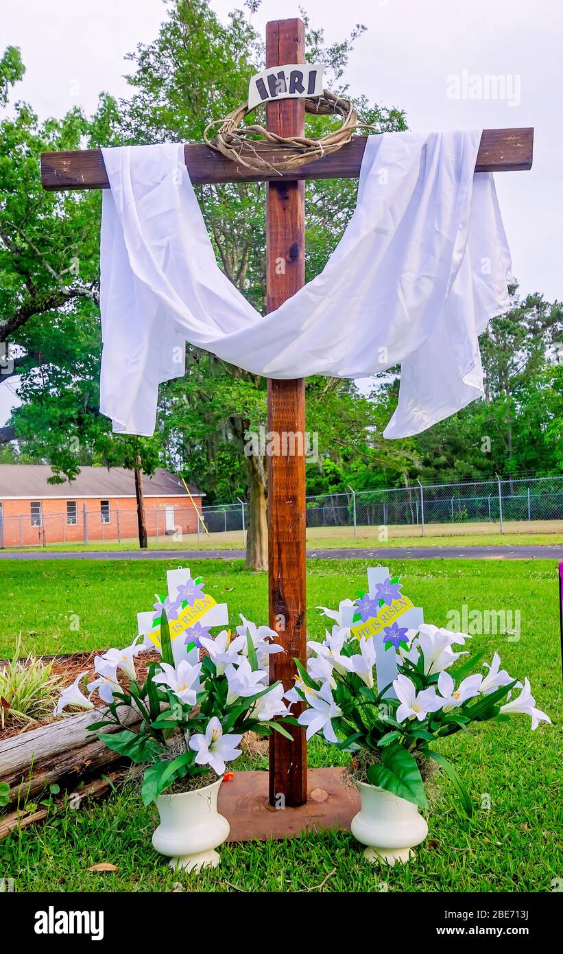 A cross with a white sash stands in front of Coden United Methodist Church for Easter, April 11, 2020, in Coden, Alabama. Stock Photo