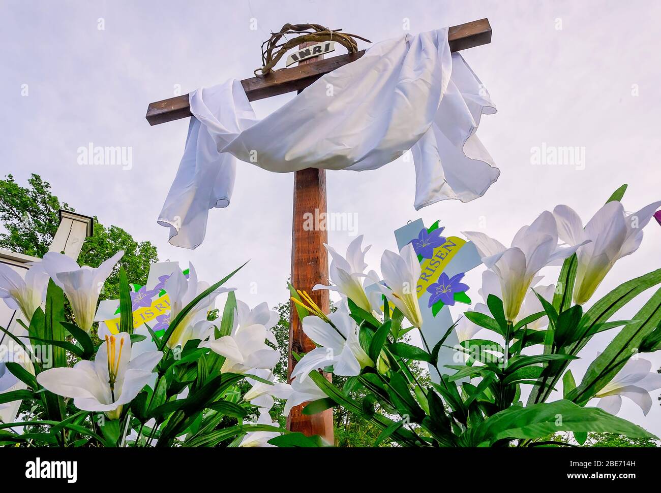 A cross with a white sash stands in front of Coden United Methodist Church for Easter, April 11, 2020, in Coden, Alabama. Stock Photo