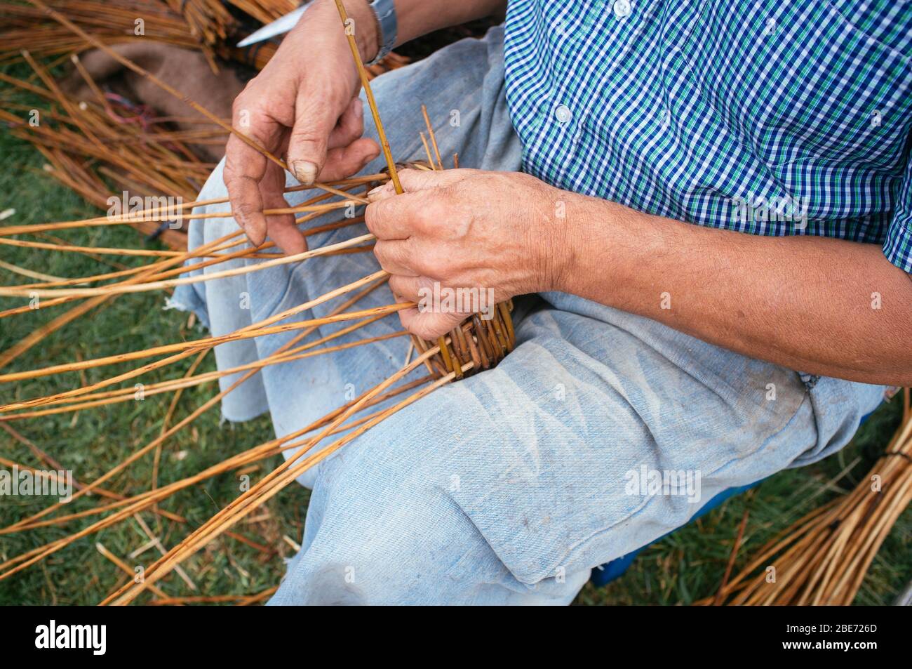 craftsman weaving a wicker basket Stock Photo Alamy