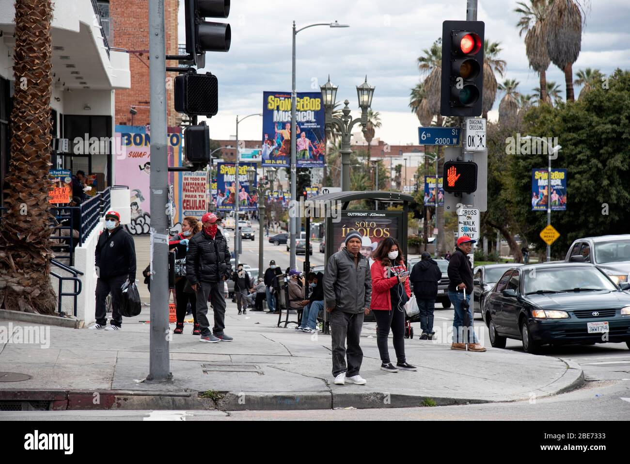 Los Angeles, CA/USA - April 9, 2020: Poor and indigent people crowd together on the streets of the Westlake neighborhood during coronavirus quarantine Stock Photo