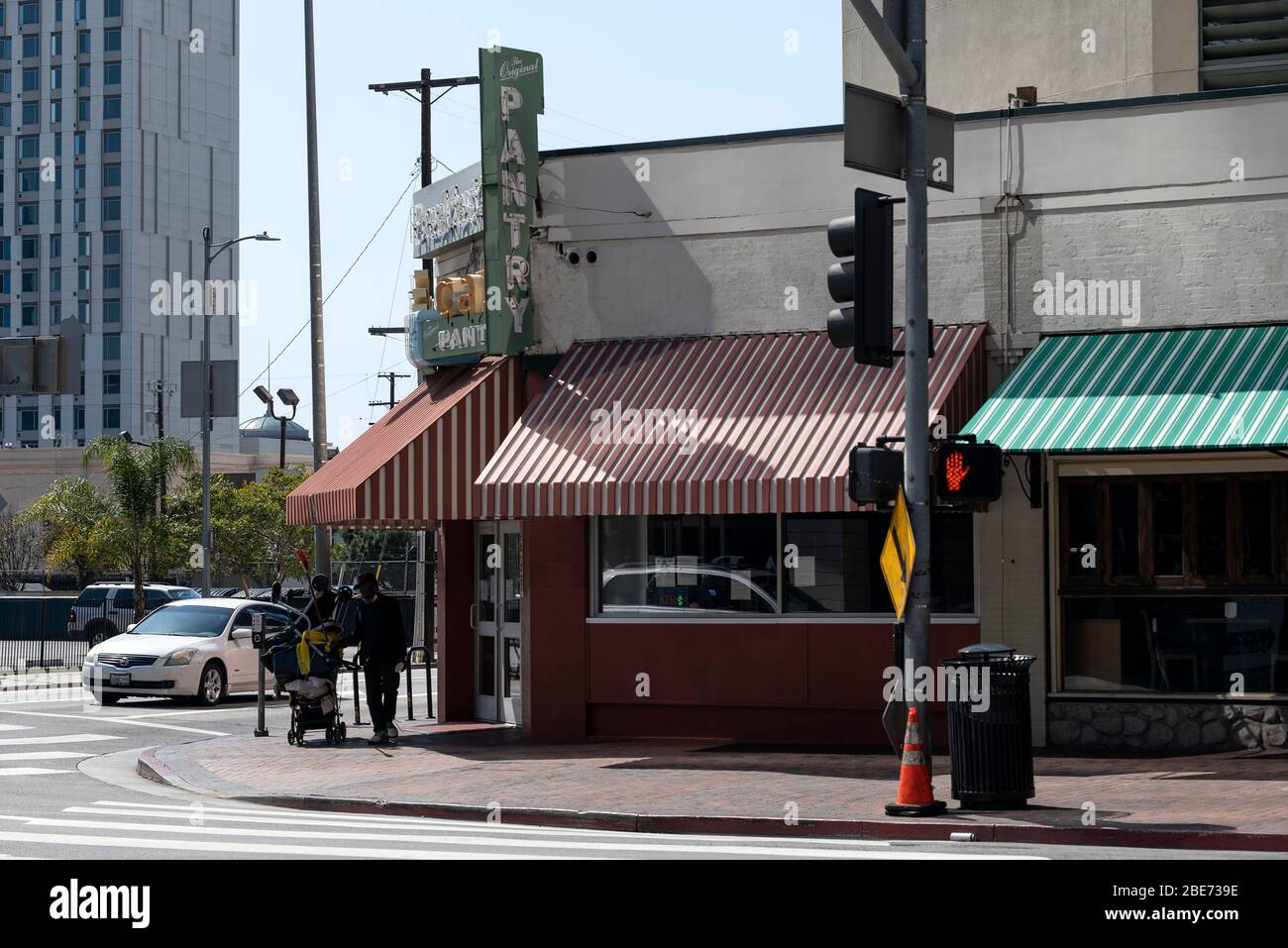 Los Angeles, CA/USA April 11, 2020 A homeless man stands in front of