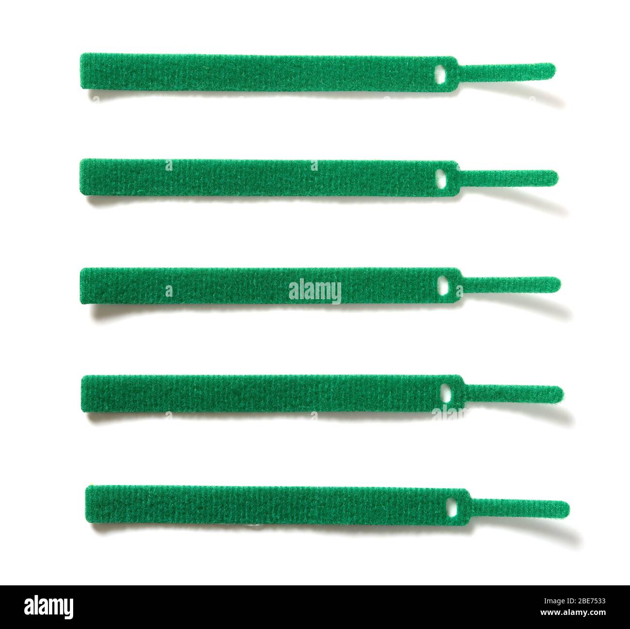 green velcro cable ties on white background Stock Photo