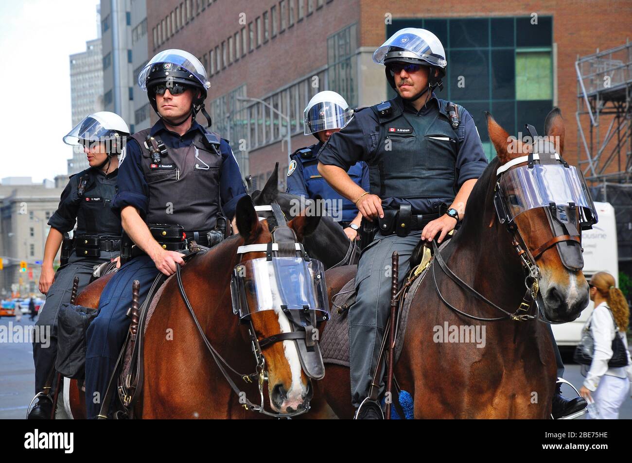 Toronto, Ontario, Canada - 05/29/2009: Mounted police keeping the protestors apart in Toronto, Ontario, Canada. Stock Photo