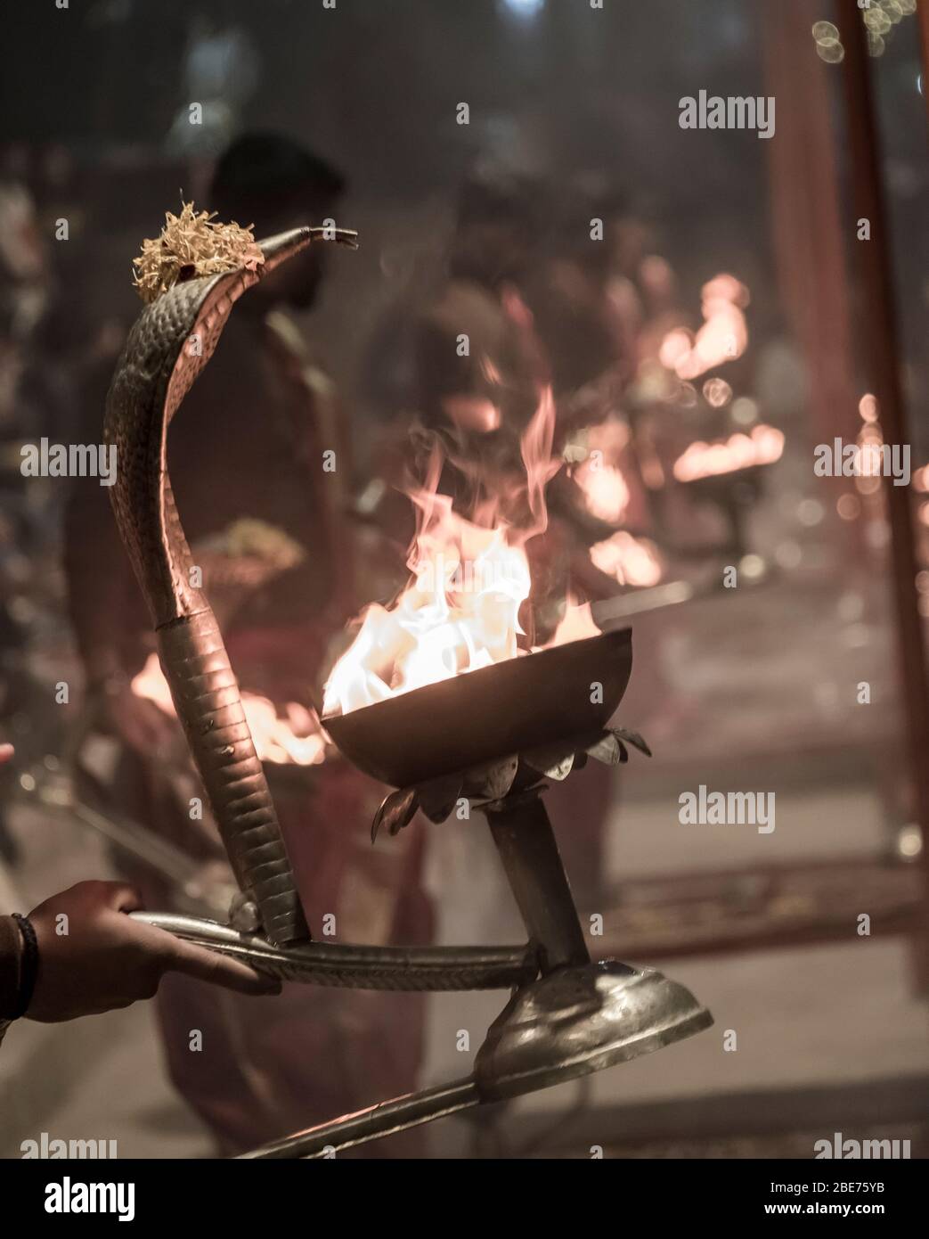 Snake-shaped lanters during Aarti performance in Varanasi, India Stock Photo