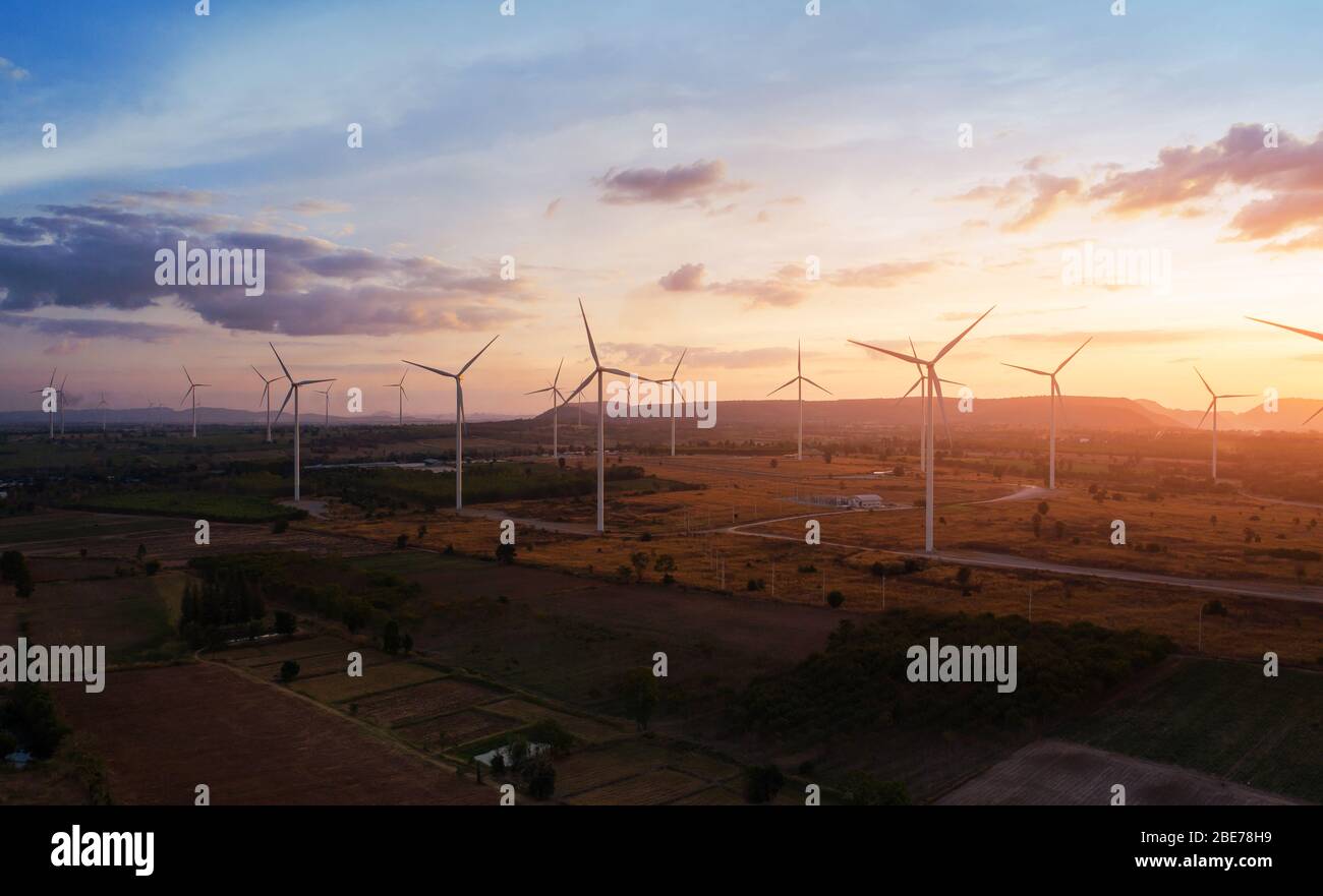 Aerial view of large wind turbines at sunset taken from the air. wind ...
