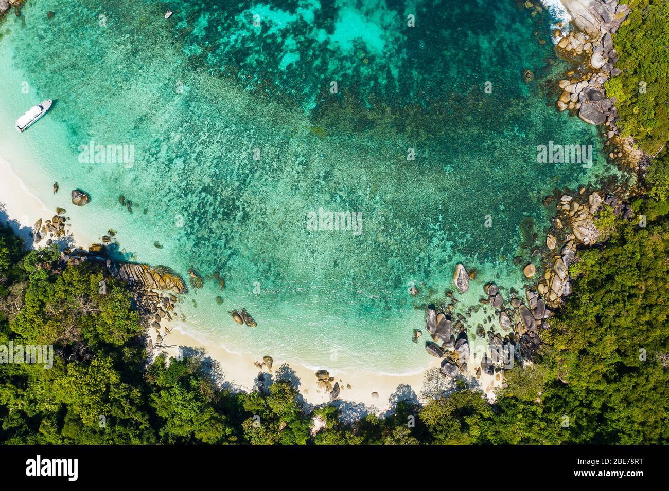 Aerial view drone shot ocean waves, Beautiful tropical beach and rocky coastline and beautiful forest. Nga Khin Nyo Gyee Island Myanmar. Tropical seas Stock Photo