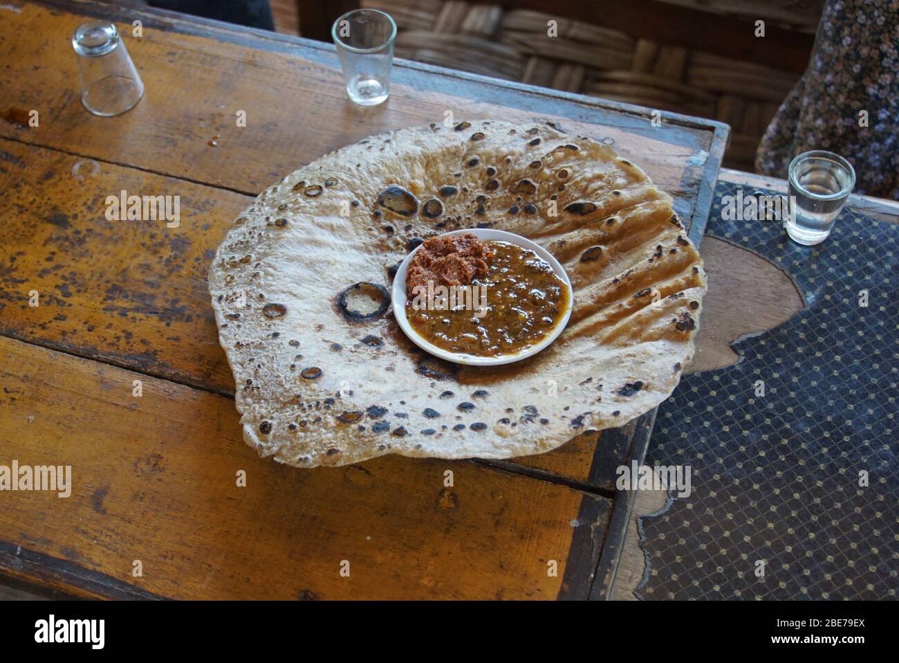 Table with freshly made Kocho Bread and Condiments Stock Photo